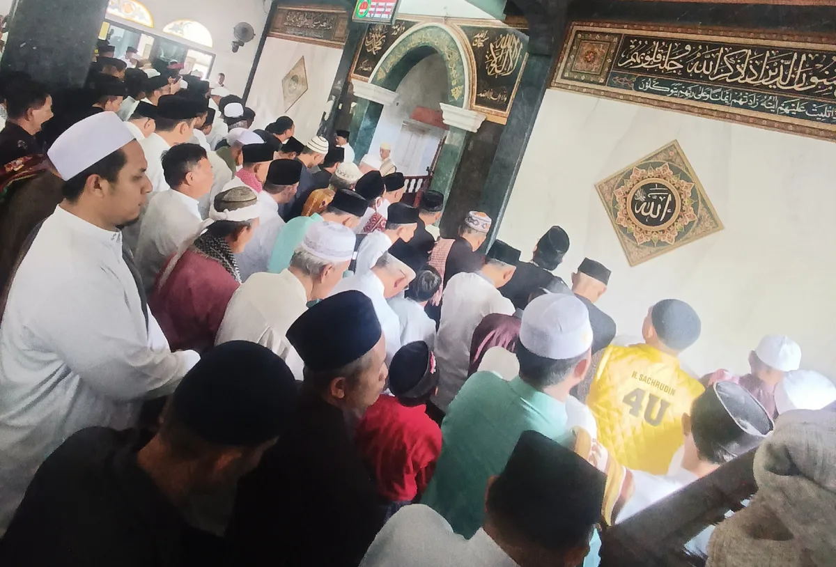 almarhumah